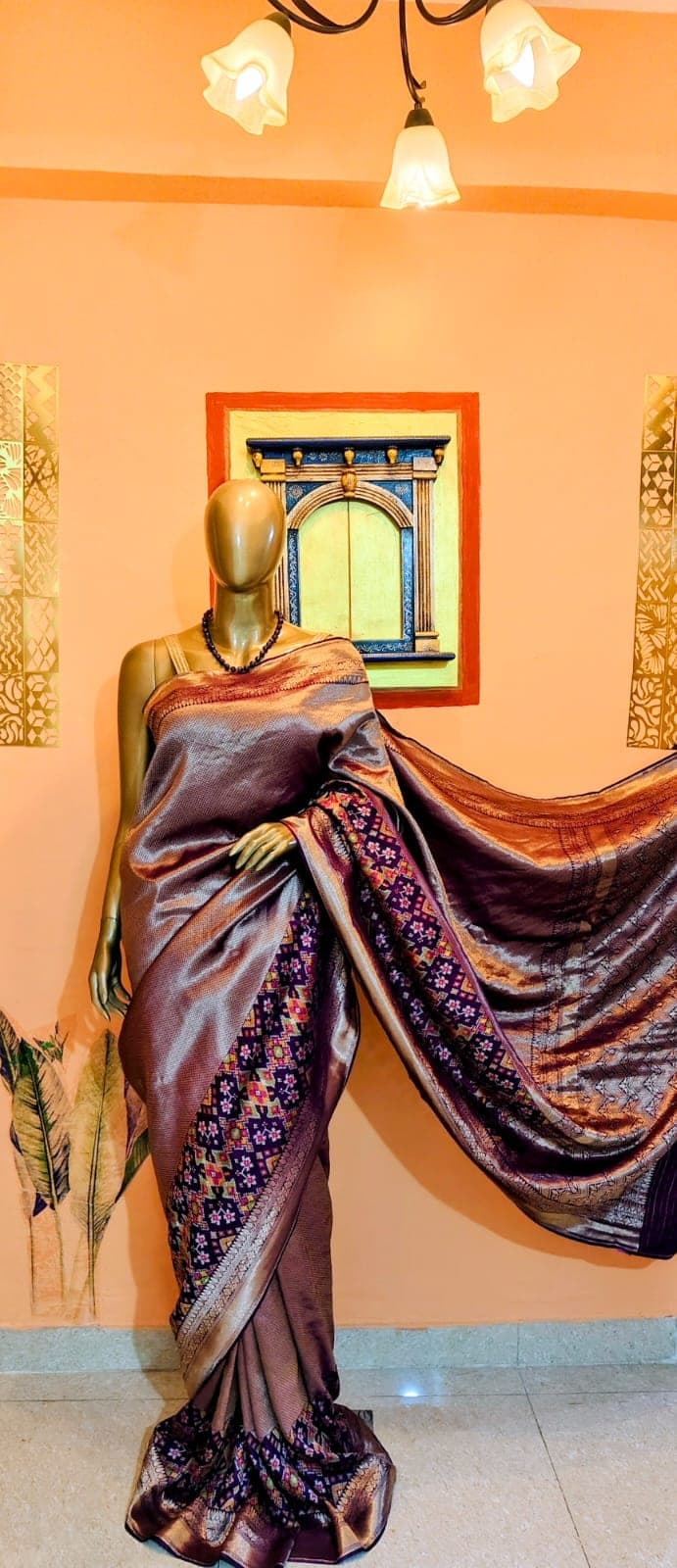 Antique-gold saree with the pallu extended