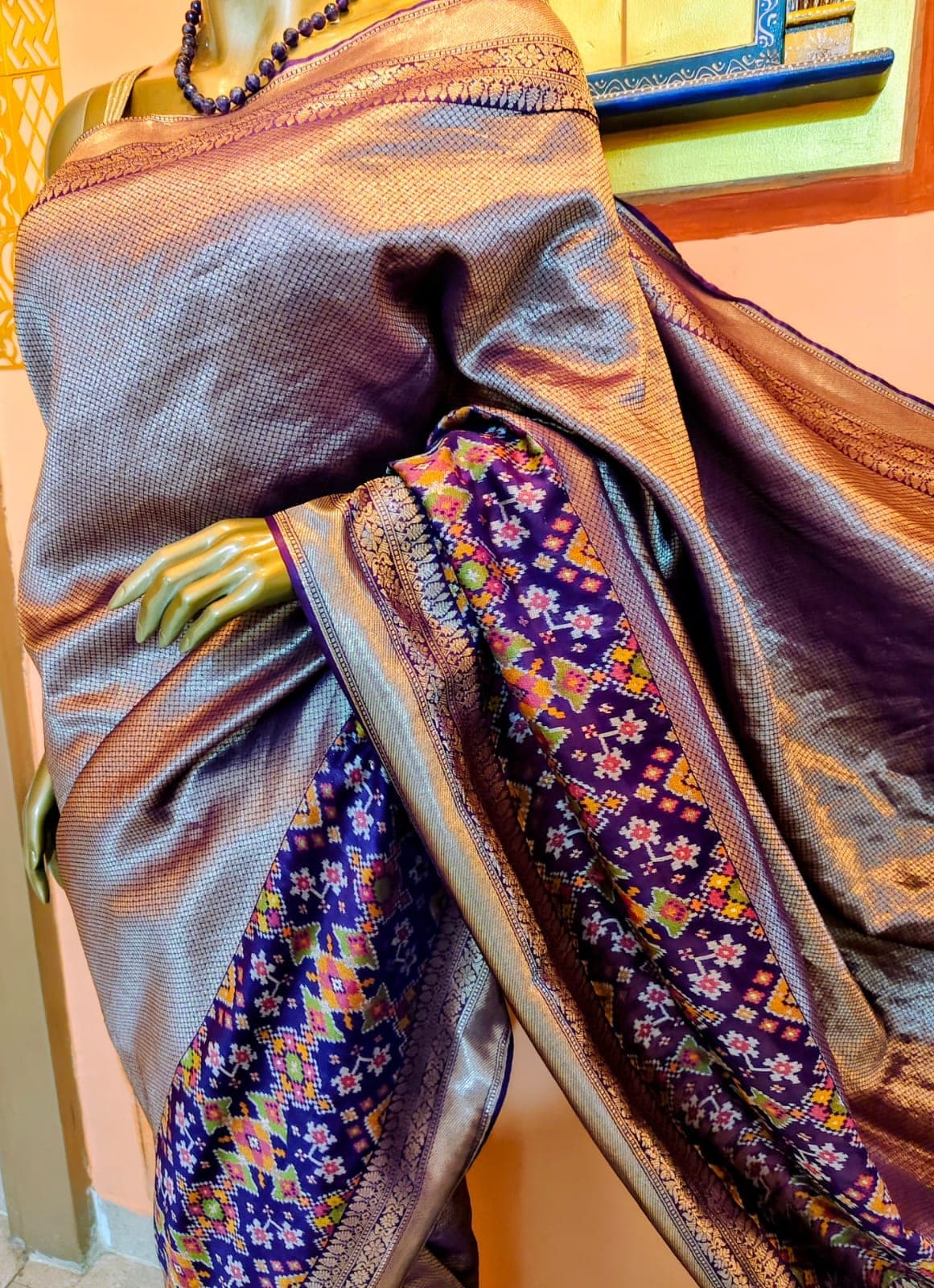 Border and body of the antique-gold saree