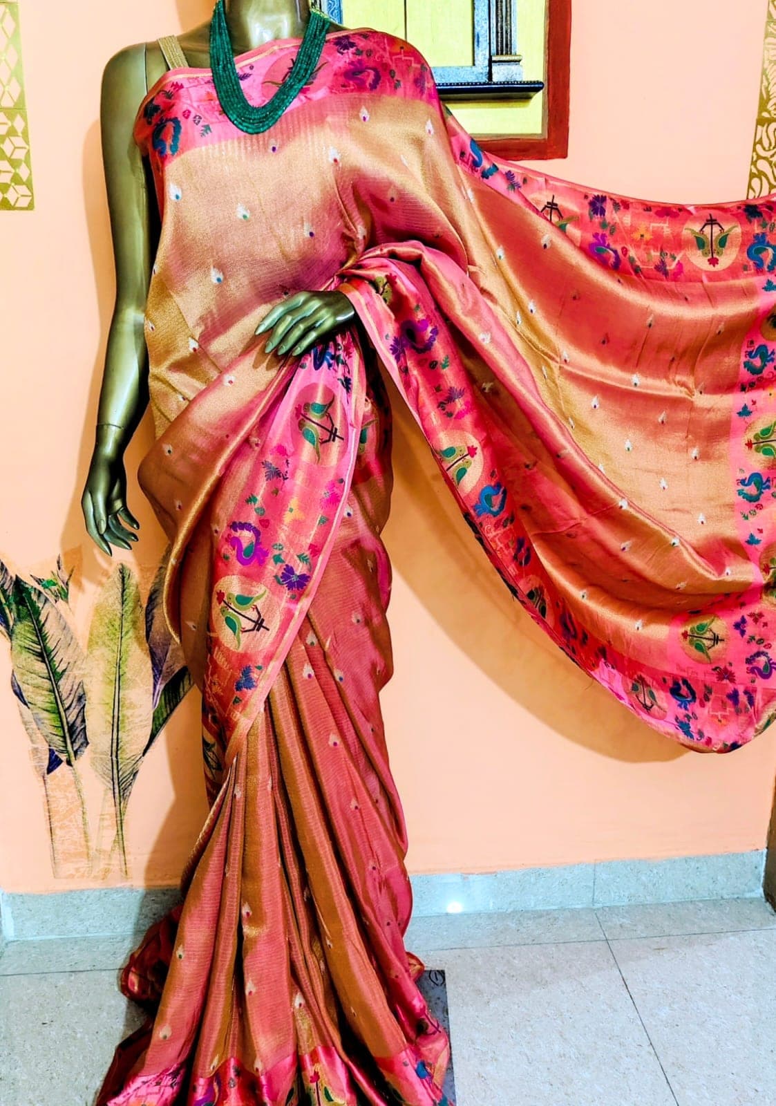 Pink figured pallu of the coral saree, spread out