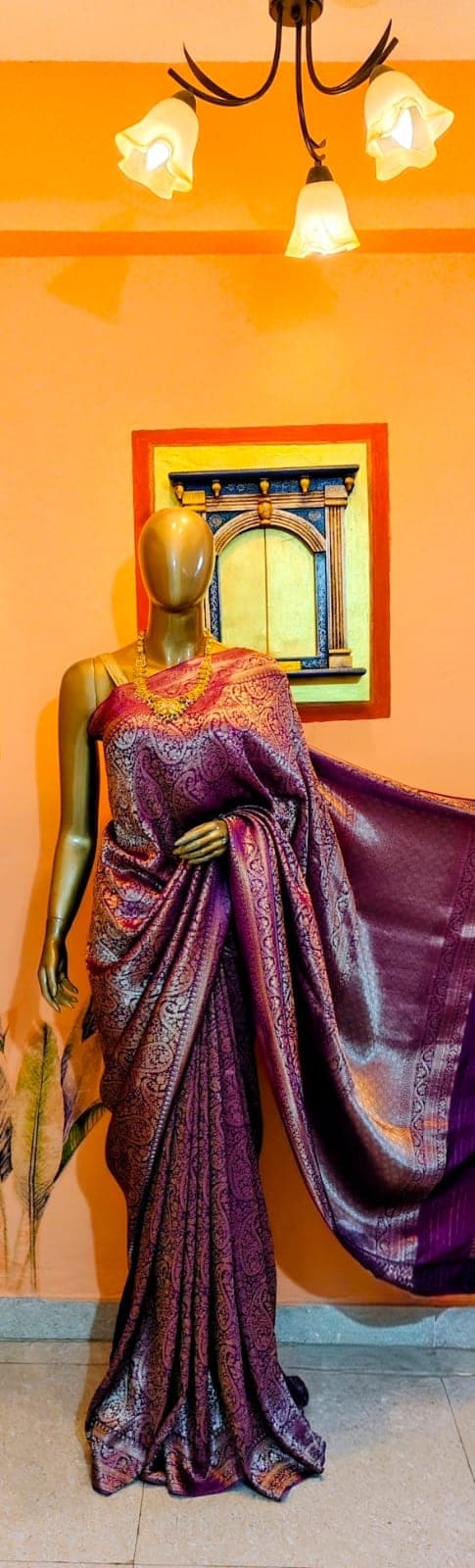 Full-length view of the purple paisley saree