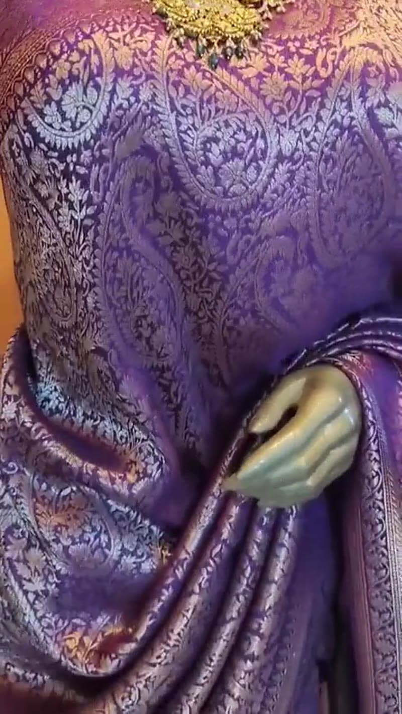 The purple paisley saree shown in motion