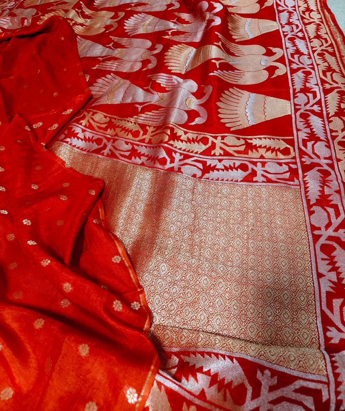 Draped fall of the red saree